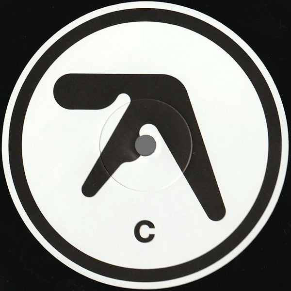 Centro del vinilo Aphex Twin – Selected Ambient Works 85-92, lado C, con diseño minimalista en blanco y negro y letra C destacada.