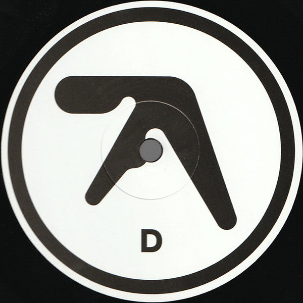 Etiqueta del lado D del vinilo Aphex Twin – Selected Ambient Works 85-92, mostrando el logotipo de Aphex Twin y la letra D centrada.