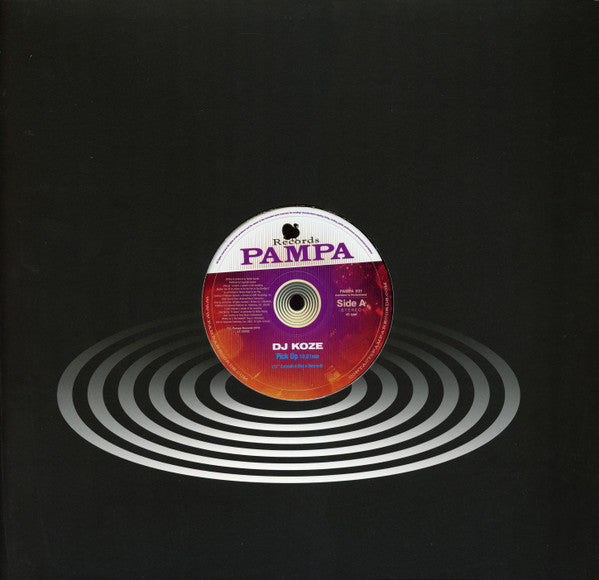 Portada del vinilo DJ Koze – Pick Up (12") editado por Pampa Records, diseño con centro visible y ondas circulares.