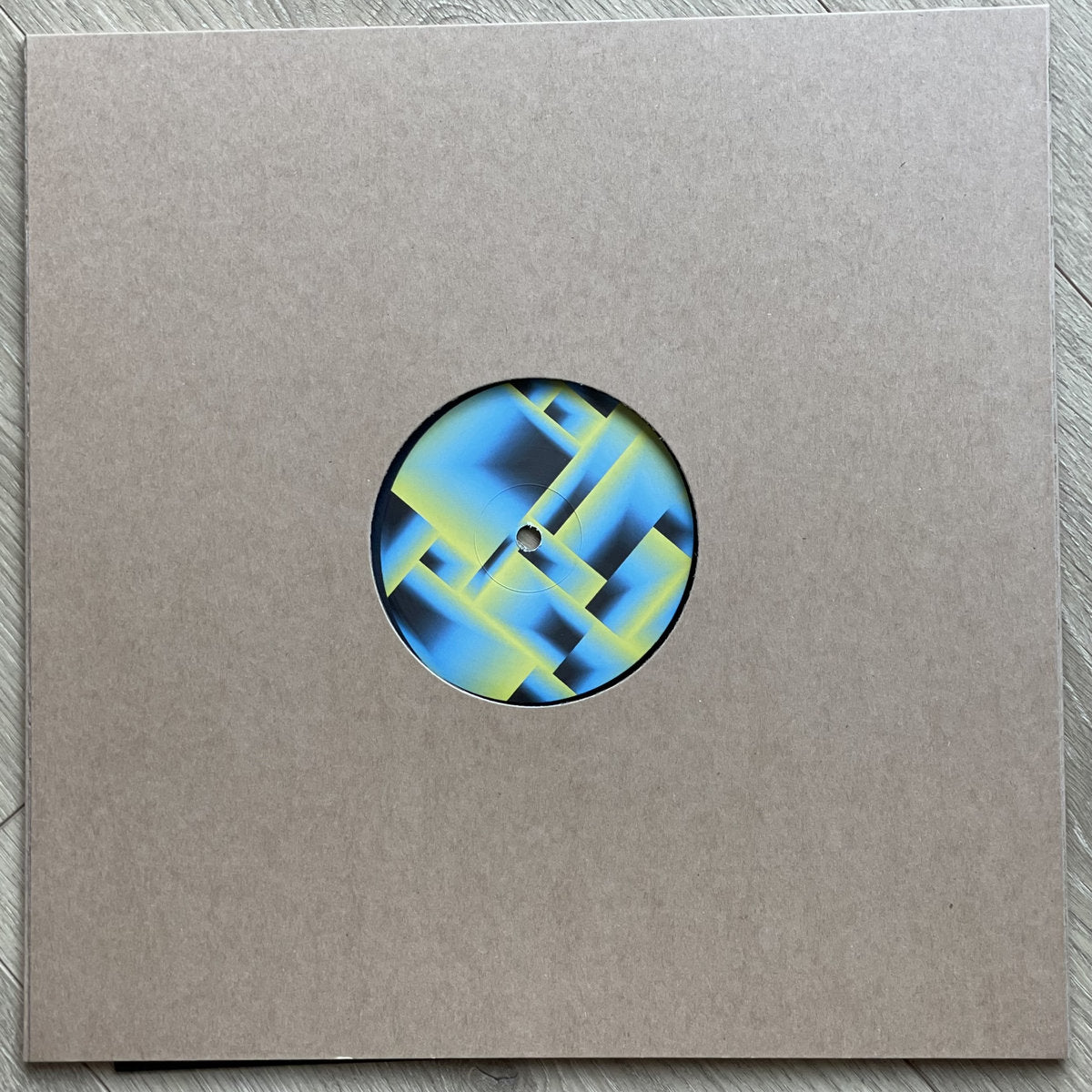 Contraportada del vinilo Franck Roger – Deep Squares EP con el lado B parcialmente visible en su funda kraft, diseño abstracto.