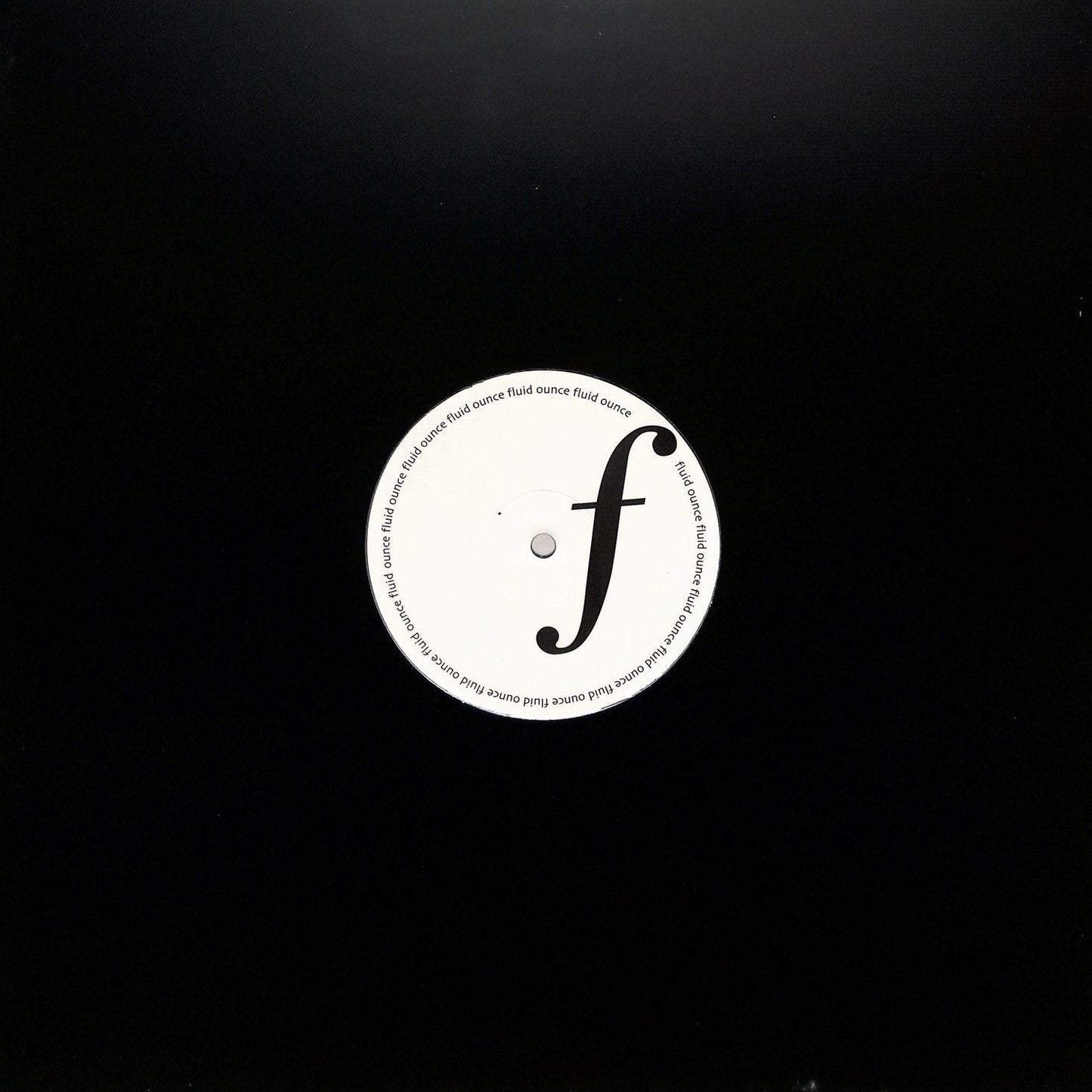 Portada del vinilo Jimi Tenor – Release Me! en 12" por Fluid Ounce, funda negra con orificio central que deja ver la etiqueta del lado A.
