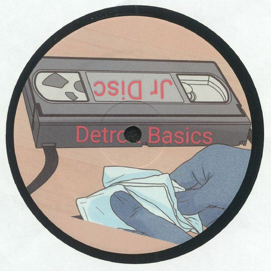 Etiqueta central lado A del vinilo JR Disc – Detroit Basics #2 con ilustración de cinta VHS y logo del sello Detroit Basics.