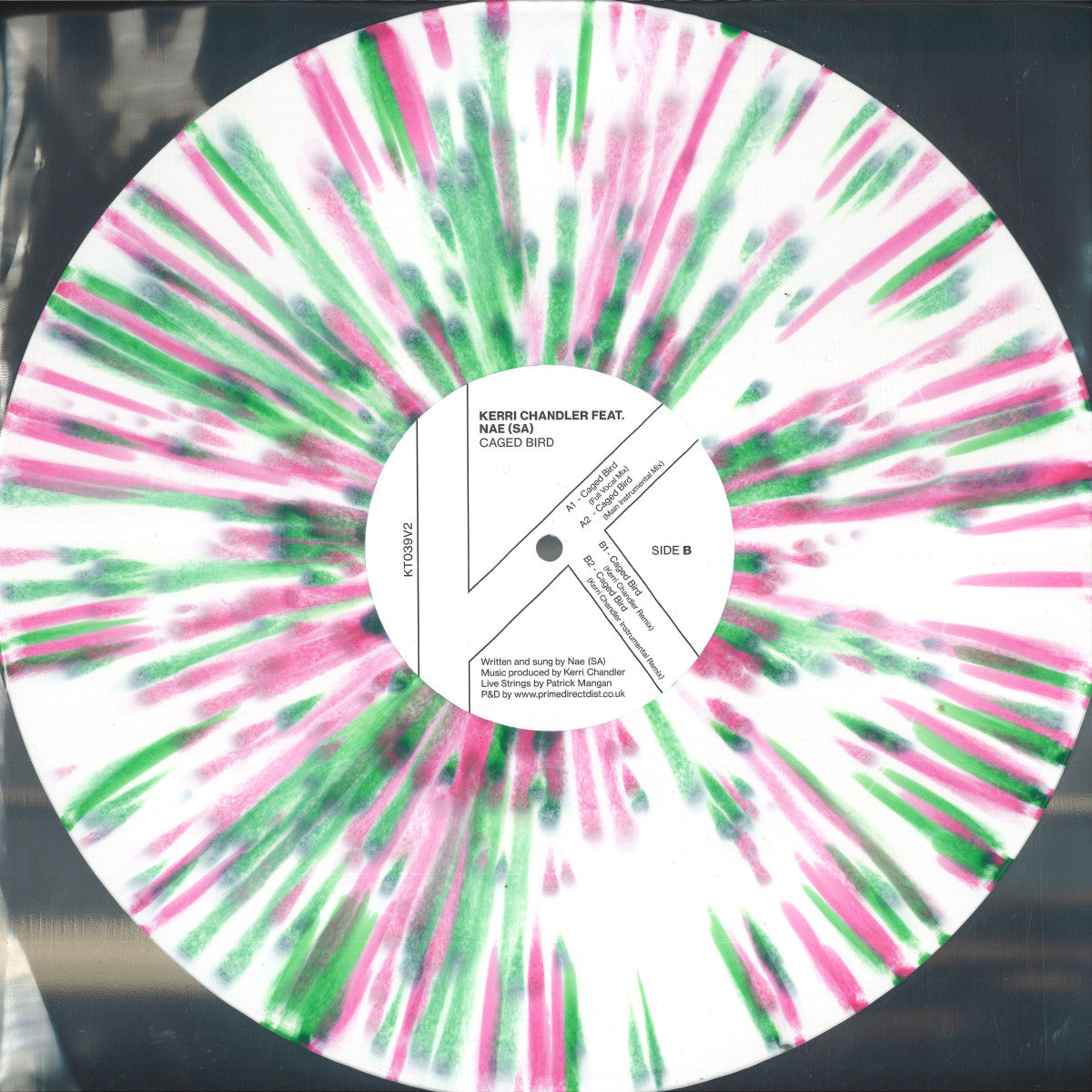 Lado B del vinilo Kerri Chandler Feat. Nae (SA) – Caged Bird en formato 12", con créditos, listado de pistas y diseño salpicado blanco.