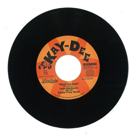 Etiqueta central del vinilo 7" de Leon Mitchison & the Eastex Freeway Band – What Cha Need, lado A, con diseño naranja de Kay-Dee Records y detalles de pista, duración y créditos.