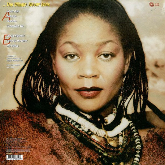 Contraportada del vinilo Letta Mbulu – In The Music... The Village Never Ends de Be With Records. Texto impreso: lista de canciones, créditos de producción y sello.