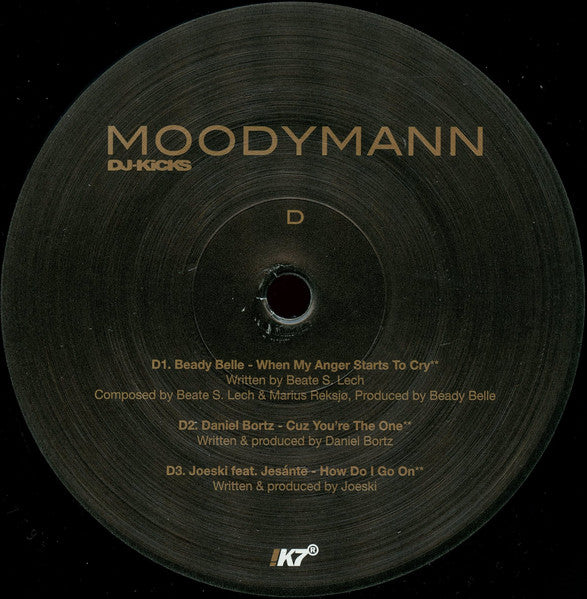 Etiqueta central del lado D del vinilo Moodymann – DJ-Kicks con temas de Beady Belle, Daniel Bortz y Joeski, edición !K7 Records.