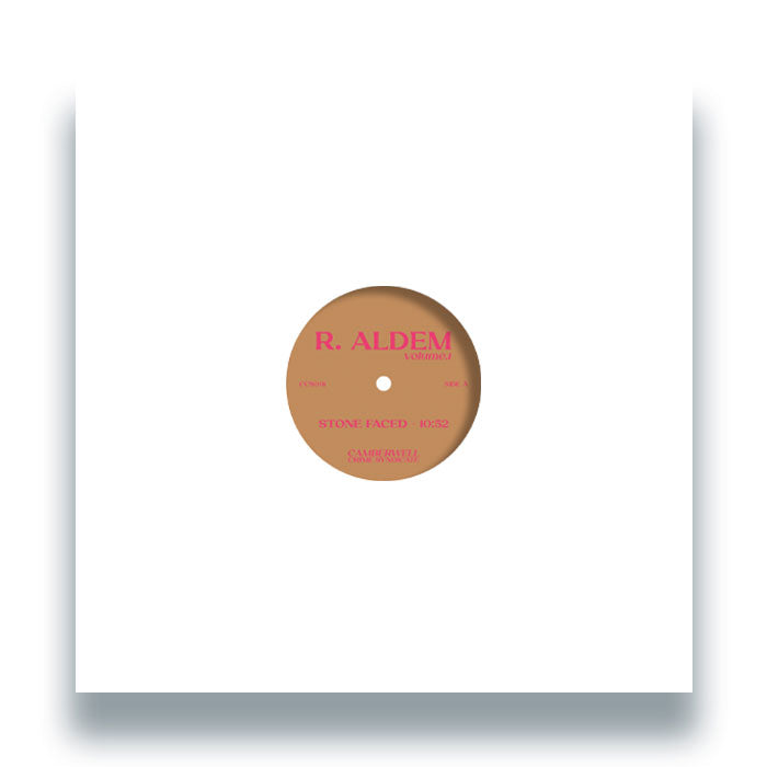 Vista frontal del vinilo R. Aldem – Volume 1 en su funda blanca, con la etiqueta del lado A visible al centro del disco de 12", editado por Camberwell Crime Syndicate.
