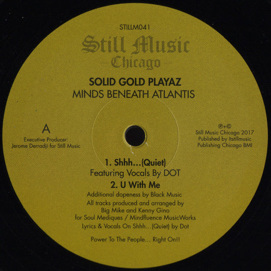 Portada delantera del vinilo Solid Gold Playaz – Minds Beneath Atlantis publicado por Still Music. Texto impreso: lado A con dos temas, créditos de producción y vocales de DOT.