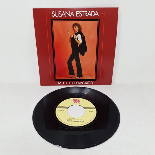 Vinilo 7" Susana Estrada – Mi Chico Favorito junto a su portada, reedición Vampi Soul con etiqueta central visible y diseño clásico.