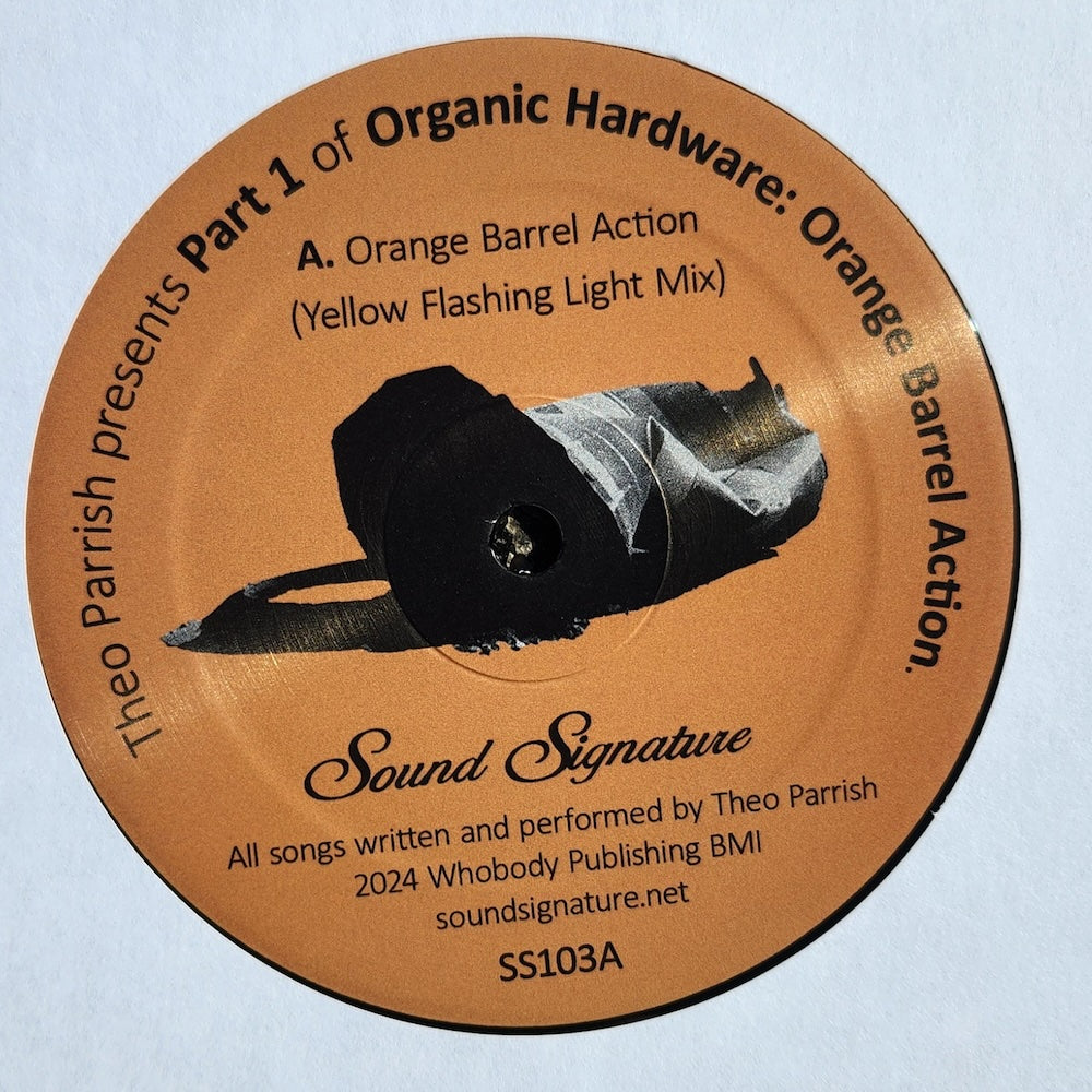 Etiqueta del lado A del vinilo Orange Barrel Action de Theo Parrish. Contiene la mezcla "Yellow Flashing Light".