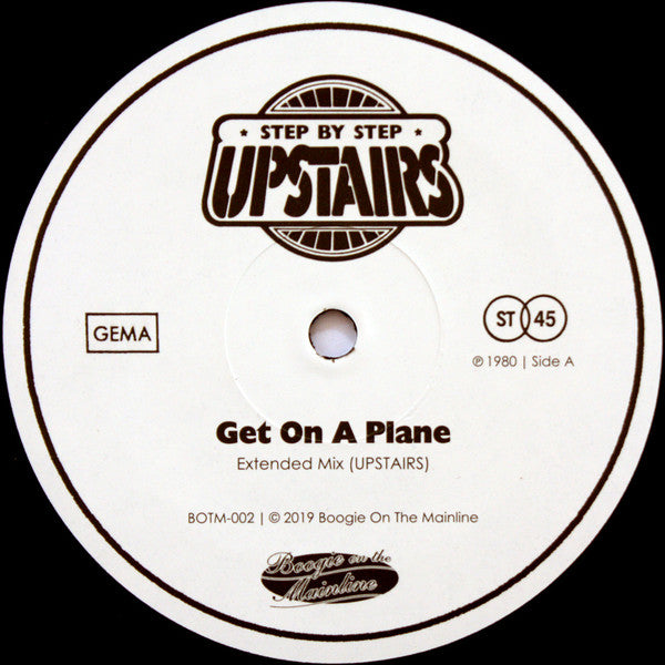 Etiqueta del lado A del vinilo "Get On A Plane / You're Just Yourself" de Upstairs. Incluye el tema "Get On A Plane" (Extended Mix) en 45 RPM.