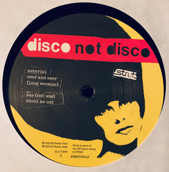 Lado B del vinilo con tracks de Material y Was (Not Was). Texto impreso: incluye detalles del sello Strut.