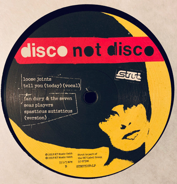 Lado C del vinilo con canciones de Loose Joints e Ian Dury. Texto impreso: títulos con créditos de producción visibles.