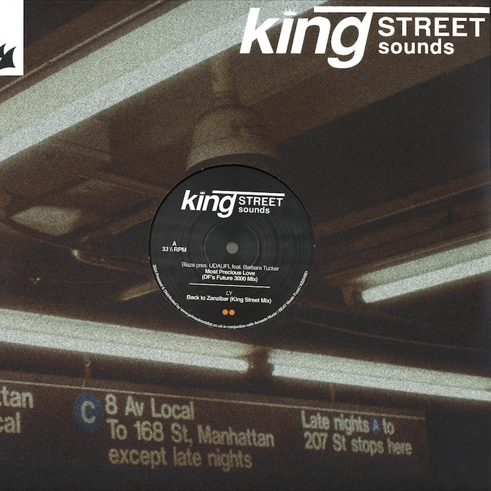 Portada delantera del vinilo King Street Sounds Sampler Vol. 1 (12", BPM King Street Sounds). Presenta el logo del sello y un fondo con una estación de metro de Nueva York.