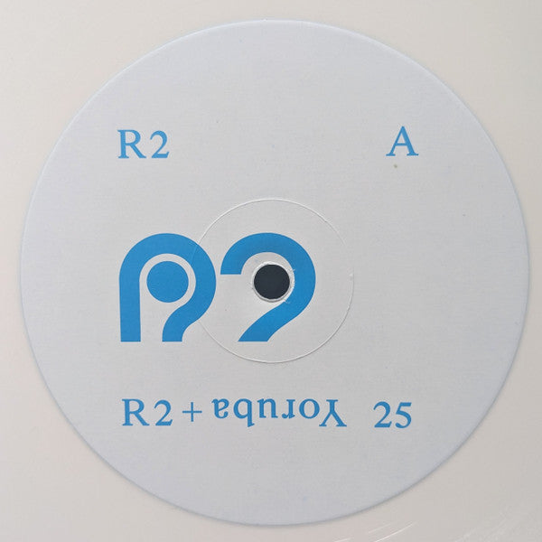 Etiqueta central del vinilo Varios Artistas – R2 + Yoruba 25, R2 Disc lado A con logo azul y diseño minimalista.