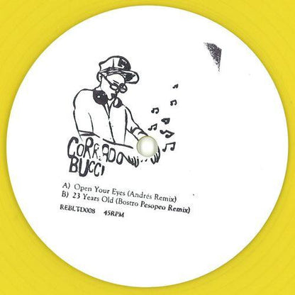 Etiqueta central del vinilo Corrado Bucci – Open Your Eyes de Rebirth, edición limitada 10" amarilla, con arte dibujado del DJ, pistas “Open Your Eyes (Andrés Remix)” y “23 Years Old (Bostro Pesopeo Remix)” claramente visibles en la cara A.