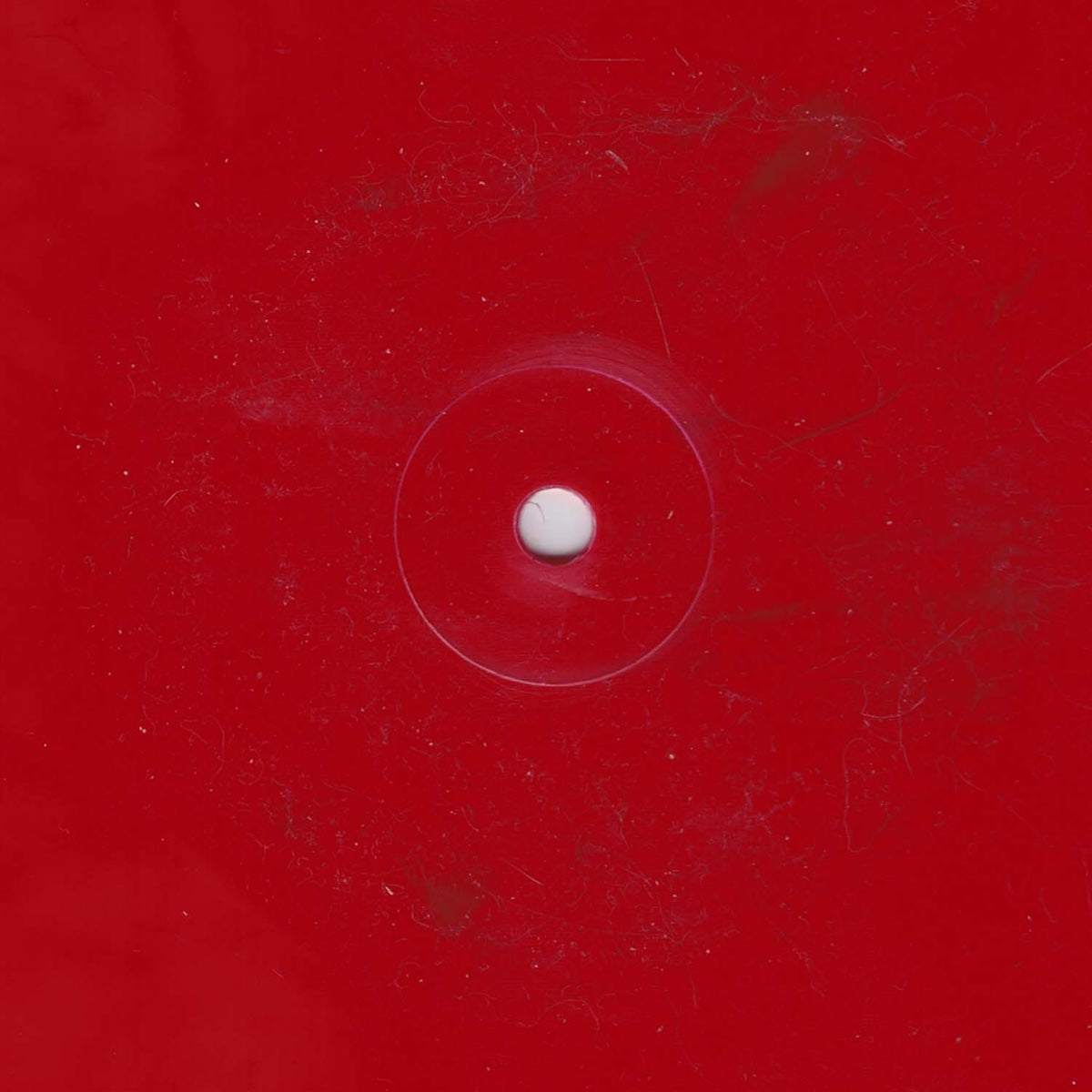 Lado B del vinilo DJ Willie Oboe – Slyness, 12" rojo estampado de Börft Records, cara sin etiqueta visible mostrando el color rojo intenso del prensado.