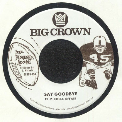 Etiqueta central del lado A del vinilo El Michels Affair – Say Goodbye / Magica editado por Big Crown Records, formato 7" 45 RPM. Diseño retro en blanco y marrón con ilustración de jugador de fútbol americano y créditos de producción de L. Michels visibles.