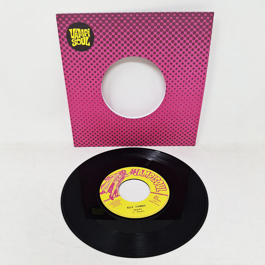 Vinilo Ely Combo – Shaft / Express Yourself con funda troquelada y etiqueta amarilla del lado A visible.