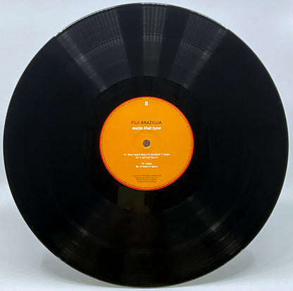 Etiqueta central lado B del vinilo Fila Brazillia – Maim That Tune mostrando título, pistas visibles y sello Growing Bin Records en reedición 2 LP.