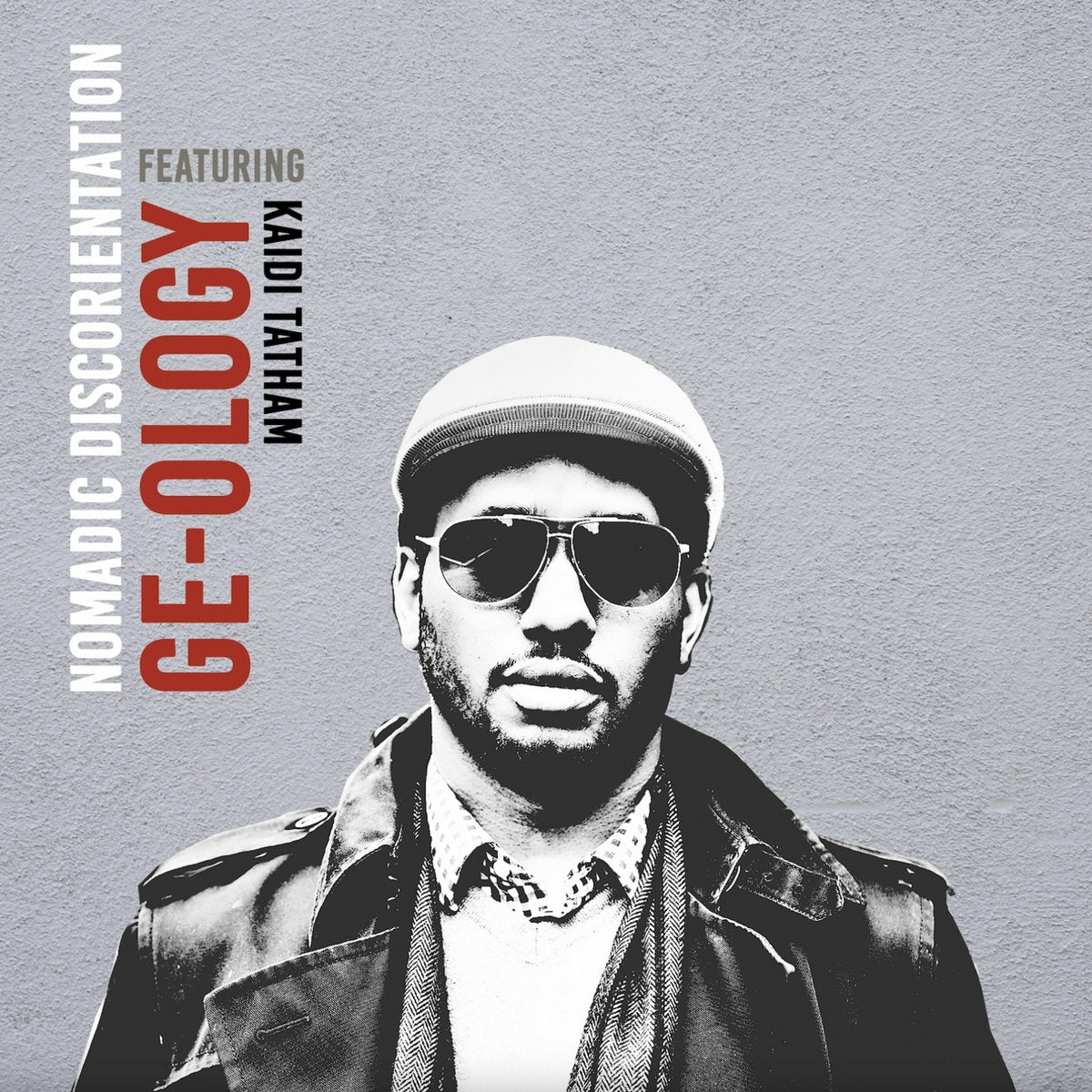 Portada del vinilo 12" GE-OLOGY Feat. Kaidi Tatham – Nomadic Discorientation, retrato en alto contraste sobre fondo gris con tipografía vertical minimalista de Love Universal.