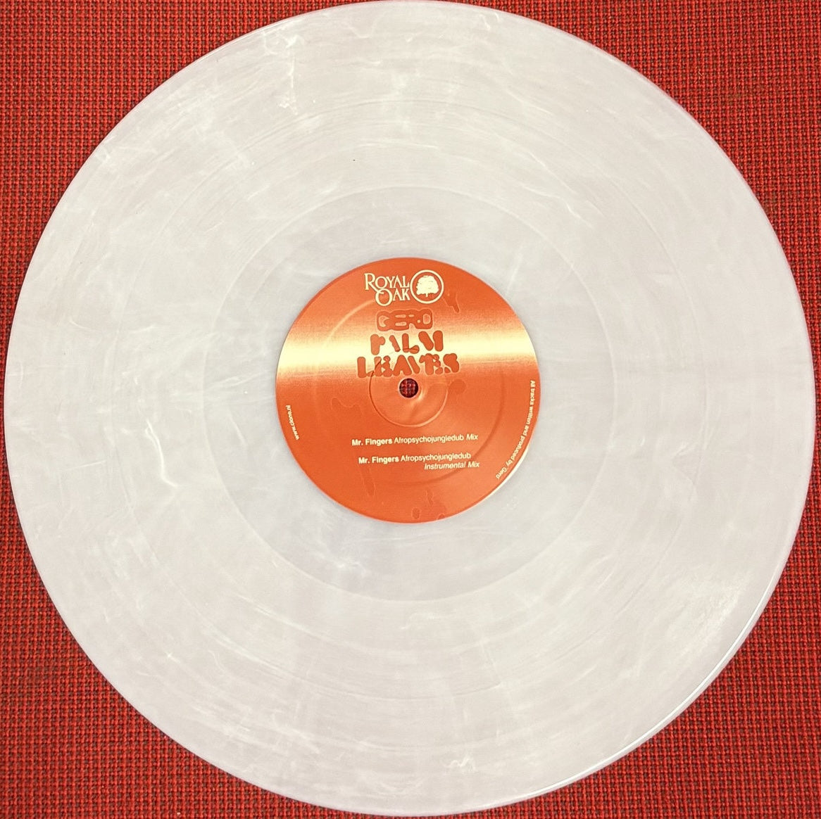 Portada del vinilo Gerd – Palm Leaves Remixes 12" Blanco Nieve en Royal Oak, etiqueta naranja con logo y mixes de Mr. Fingers visibles en el centro.