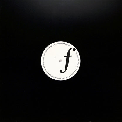 Portada del vinilo Jimi Tenor – Release Me! en 12" por Fluid Ounce, funda negra con orificio central que deja ver la etiqueta del lado A.