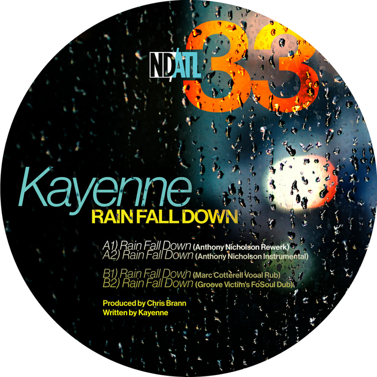 Etiqueta de vinilo Kayenne – Rain Fall Down de NDATL Muzik con lista de pistas del 12" EP sobre fondo lluvioso y créditos visibles.