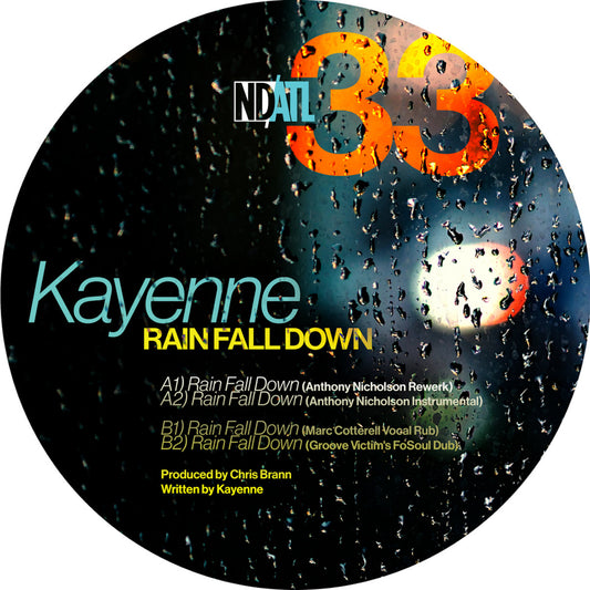 Etiqueta de vinilo Kayenne – Rain Fall Down de NDATL Muzik con lista de pistas del 12" EP sobre fondo lluvioso y créditos visibles.