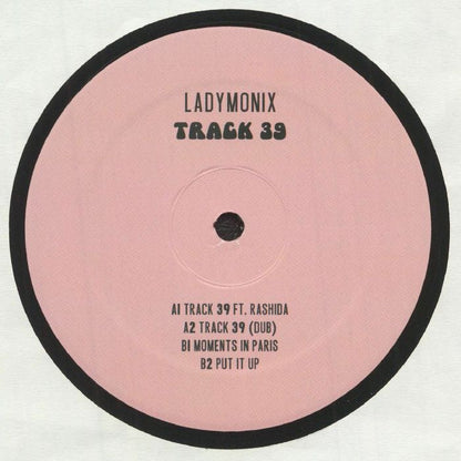 Portada delantera del vinilo LADYMONIX - "Track 39" publicado por Frizner Electric en formato 12". Diseño minimalista con fondo rosa y tipografía negra. Tracklist impreso con los temas del disco.