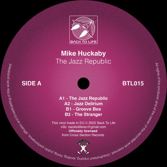 Lado A del vinilo Mike Huckaby – The Jazz Republic en 12" reedición Back To Life, etiqueta rosa con tracks A1-A2-B1-B2, catálogo BTL015 y créditos visibles.