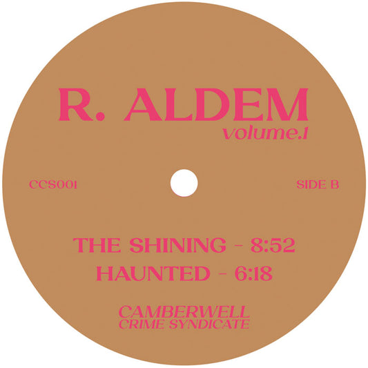 Etiqueta central del lado B del vinilo R. Aldem – Volume 1, con las pistas "The Shining" (8:52) y "Haunted" (6:18), lanzado por Camberwell Crime Syndicate.
