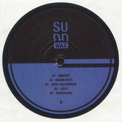 Etiqueta del lado B del vinilo Reggie Dokes – Electronic Dreams (2025 Revision) en formato 12" EP del sello Sudd WAX, mostrando la lista de pistas como “Gratiot”, “Coco” y “Woodward” sobre fondo azul oscuro minimalista.