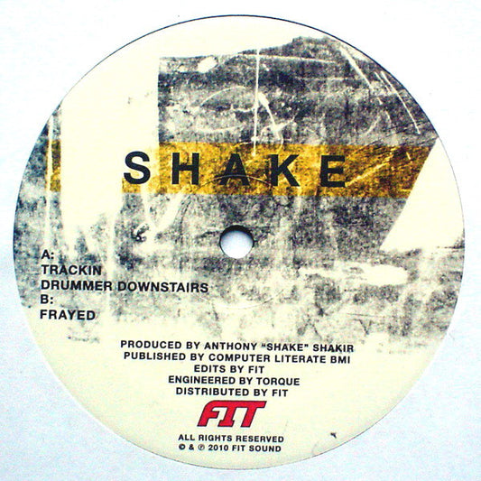 Lado A del vinilo Shake – Trackin, label Fit Sound 12", incluye Trackin y Drummer Downstairs con créditos y logo FIT.