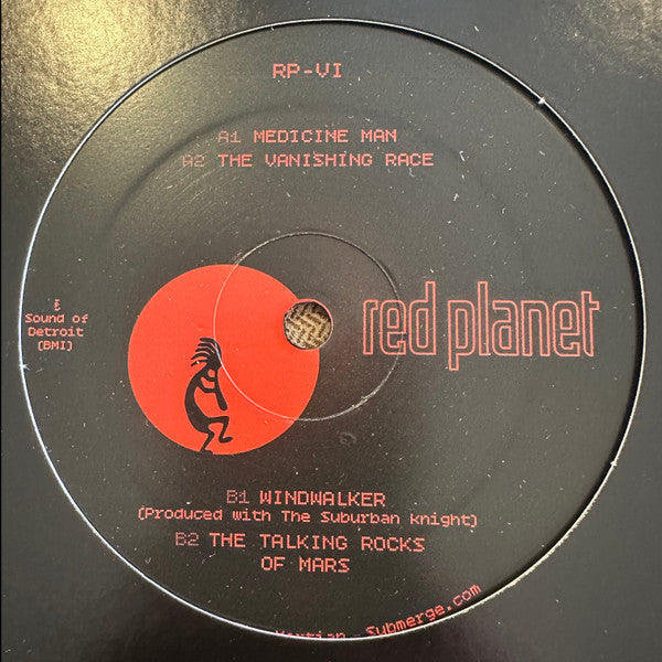 Lado A del vinilo 12" The Martian – RP-VI en Red Planet, etiqueta negra y roja con los cuatro tracks listados: Medicine Man, The Vanishing Race, Windwalker y The Talking Rocks Of Mars, catálogo RP-VI.
