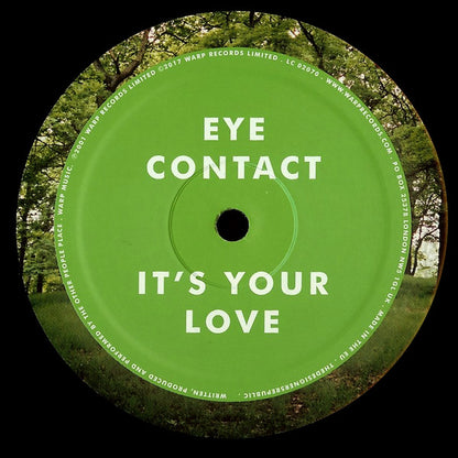 Etiqueta verde del lado A del vinilo The Other People Place – Lifestyles Of The Laptop Café con los temas “Eye Contact” y “It’s Your Love”.