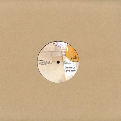 Portada del vinilo 12" T.V. Babies / Smart Alex – Deeper Situation / Specially Hot (Peace Division Remix), funda kraft minimalista con label central ES06 de Endell Street asomando.