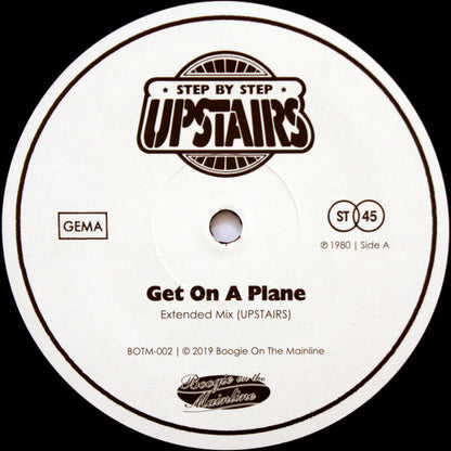 Etiqueta del lado A del vinilo "Get On A Plane / You're Just Yourself" de Upstairs. Incluye el tema "Get On A Plane" (Extended Mix) en 45 RPM.