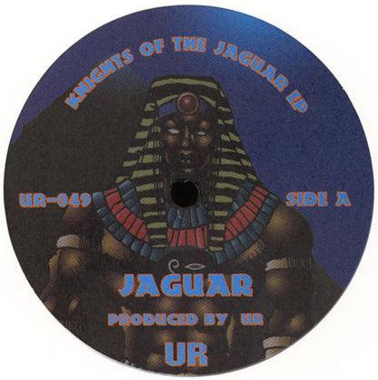 Etiqueta central del lado A del vinilo UR – Knights Of The Jaguar EP con arte egipcio, título Jaguar, créditos a UR y catálogo UR-049.