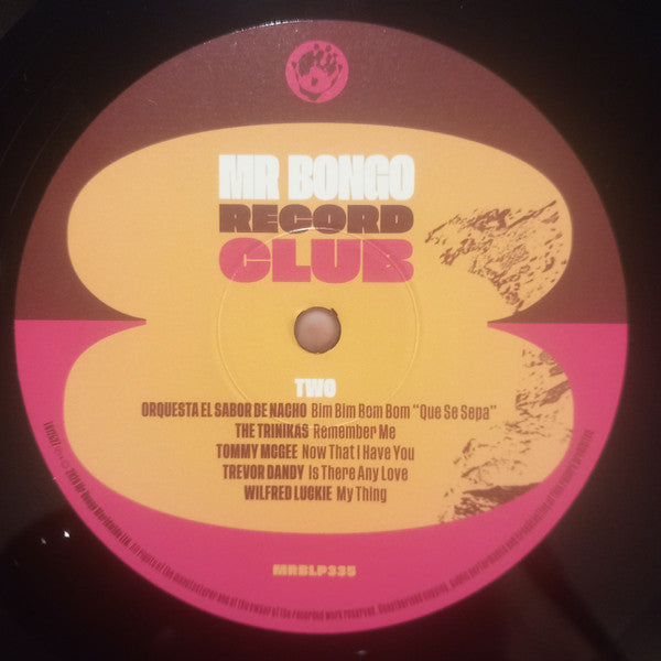 Lado B del vinilo Varios Artistas – Mr Bongo Record Club Vol. 8: cinco pistas en etiqueta amarilla y rosa.