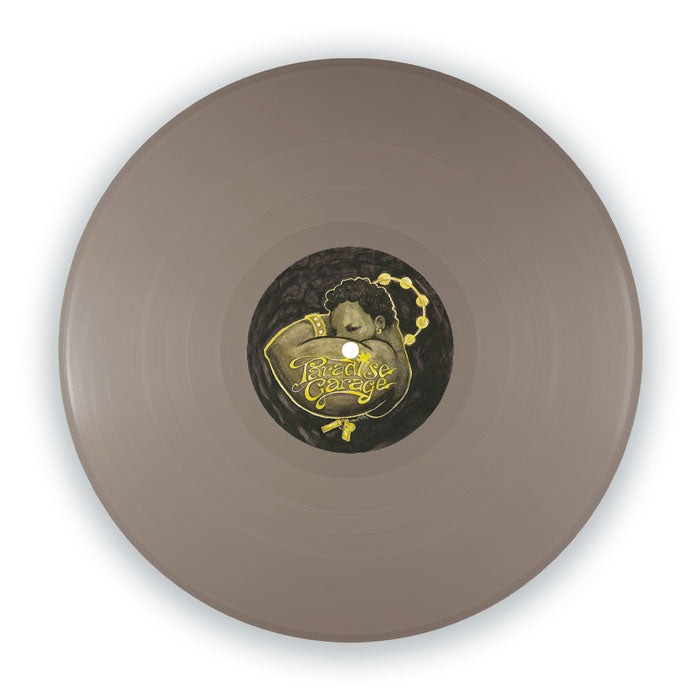 Portada delantera del vinilo Varios Artistas – Paradise Garage: Inspirations, reimpresión 12" gris editada por Good For You Records. Texto impreso: vinilo gris con etiqueta central ilustrada Paradise Garage.