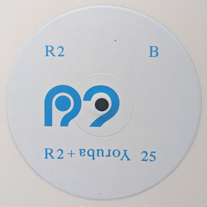 Centro del vinilo Varios Artistas – R2 + Yoruba 25, R2 Disc lado B con estética limpia y logo azul del sello R2 Records.
