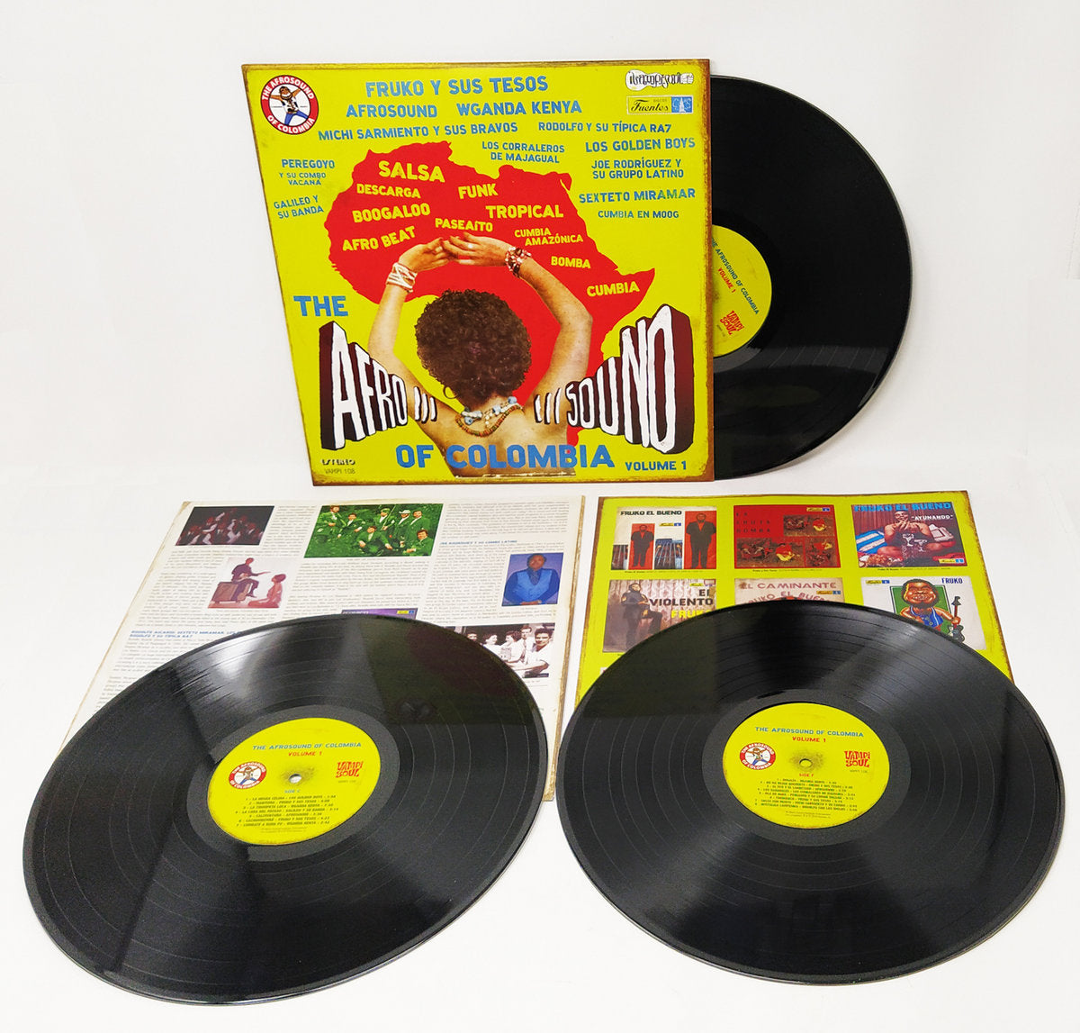 Vinilos e insert interior de Varios Artistas – The Afrosound Of Colombia Volume 1, edición Vampi Soul 3 x LP con labels amarillos visibles.