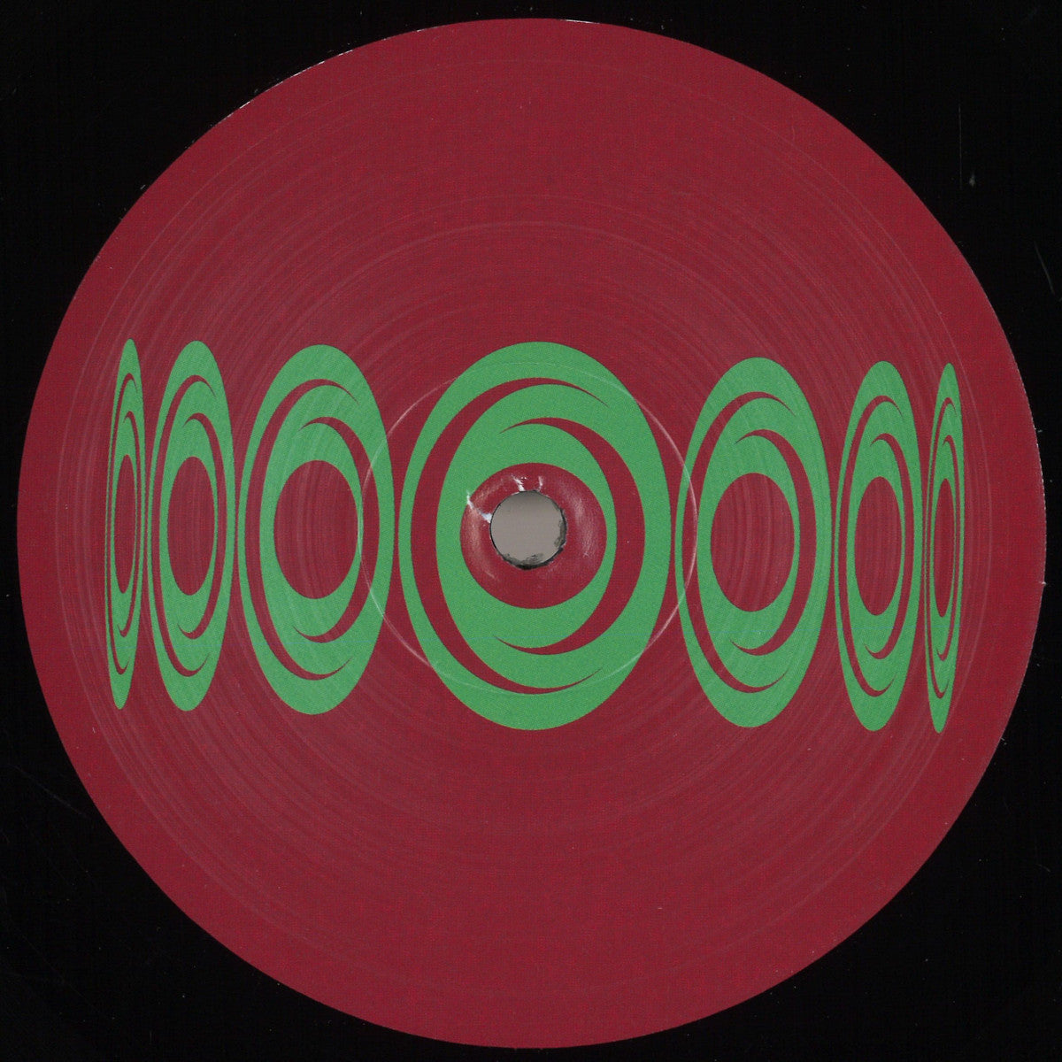 Etiqueta central lado B del vinilo 12" Varios Artistas – The Evolution Phase Five en Visions Recordings con arte geométrico circular verde sobre fondo rojo.