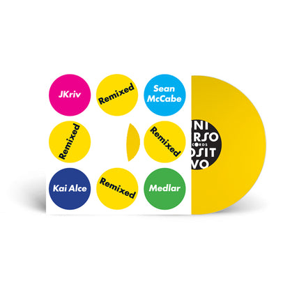 Portada del vinilo 12" amarillo Varios Artistas – Universo Positivo Remixed, con diseño geométrico de círculos de colores y disco visible.